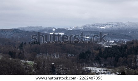 View over the Stettbachtal near Seeheim-Jugenheim in the direction of the Modautal and Lichtenberg Castle in winter with snow