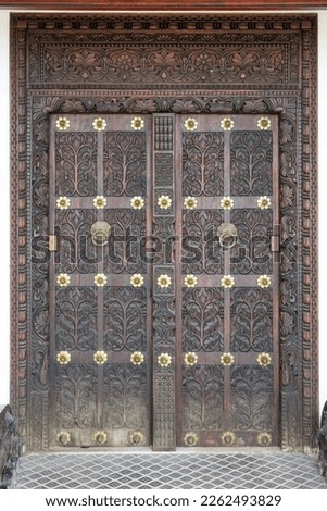 Take a closer look at the wooden masterpieces of Stone Town's doors in Zanzibar. These doors are a true reflection of the city's rich culture and history, with intricate carvings and designs that show