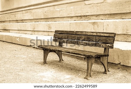 typical old wooden bench - parkbench - photo Royalty-Free Stock Photo #2262499589