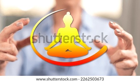 Meditation concept between hands of a woman in background