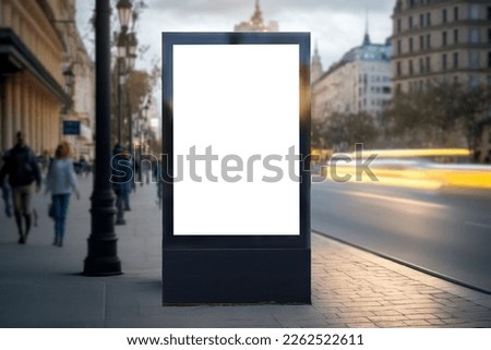 Blank city format (LightPoster, CityLight) banner pylon on the sidewalk mockup. Billboard in the city center mock up. Blurred background, focus on foreground, copy space Royalty-Free Stock Photo #2262522611