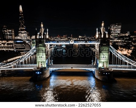Aerial drone view of London Tower Bridge at night and the River Thames, England, United Kingdom