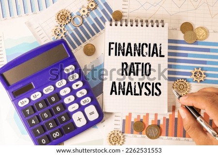 Concept of Financial Ratio Analysis write on sticky notes isolated on Wooden Table.