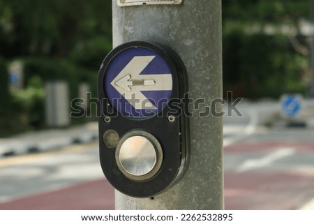 close up of crossing signal button in singapore 