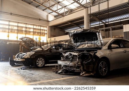 car in automobile repair service center with soft-focus and over light in the background Royalty-Free Stock Photo #2262545359