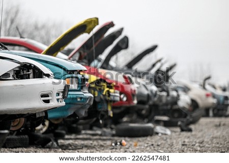 Junk cars at auto parts salvage yard in the city Royalty-Free Stock Photo #2262547481