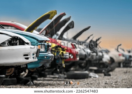 Junk cars at auto parts salvage yard in the city Royalty-Free Stock Photo #2262547483