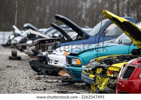 Junk cars at auto parts salvage yard in the city Royalty-Free Stock Photo #2262547491