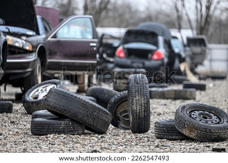 Junk cars at auto parts salvage yard in the city Royalty-Free Stock Photo #2262547493