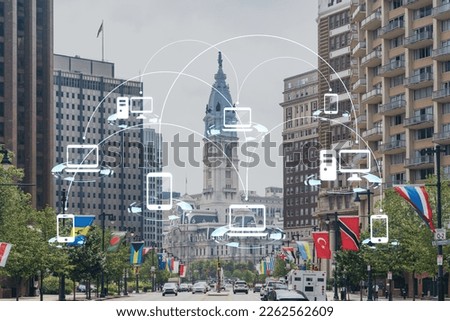 Day time cityscape of Philadelphia financial downtown, Pennsylvania, USA. City Hall neighborhood. Glowing Social media icons. The concept of networking and establishing new connections between people