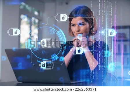 Pensive attractive beautiful businesswoman in formal wear working on laptop at office workplace in background. Concept of business education, blockchain cryptocurrency information technology.