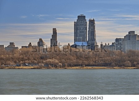 A long exposure of New York from the Hudson River walking path in Edgewater New Jersey. With a view of Grant's tomb and Riverside Church in New York. Royalty-Free Stock Photo #2262568343
