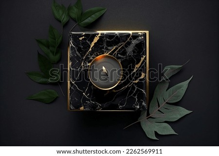 creative home deco composition. burning candles  with gold leaves isolated on dark marble background. Flat lay, top view, copy space. mother woman day	

