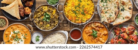 indian food feast with chicken tikka masala curry, tandoori chicken and appetizers Royalty-Free Stock Photo #2262574417