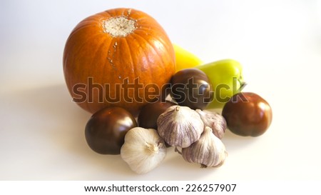  Orange pumpkin, black tomato, garlic for salad