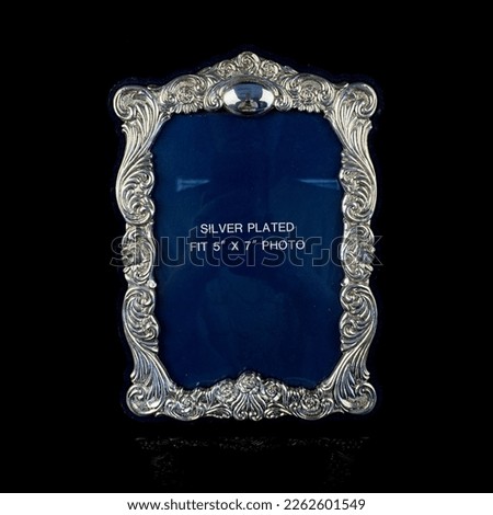 Blue picture frame isolated on a black background. Close up image. vintage silver photo frame 