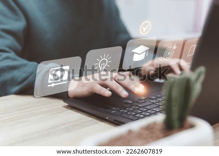 A man using laptop for work research, online education. Computer, education research, customer or student study, E-learning graduate certificate program, Futuristic technology transformation concept. Royalty-Free Stock Photo #2262607819