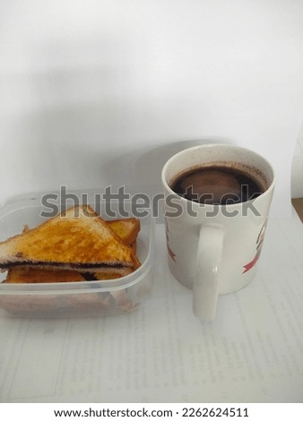 Hot coffee and pile of toast on white background.  Great for food, bakery, backdrop, coffee, drink, breakfast, cafe, delicious, dessert, sweet, sugar and more.
