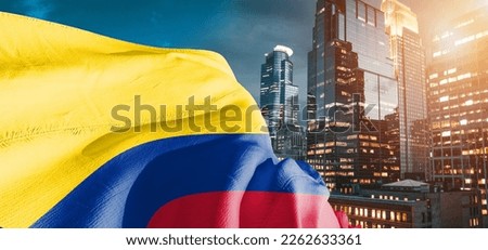 Colombia national flag cloth fabric waving on beautiful building background.