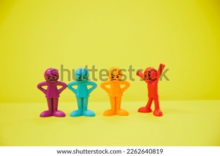 Angry dolls and happy, colorful dolls