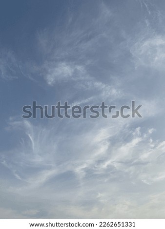 White cirrus clouds formed by whirlwinds in the air the nature of the swirling at the base of the clouds and the scattering of beautiful clouds in the evening at Bangkok, Thailand.no focus