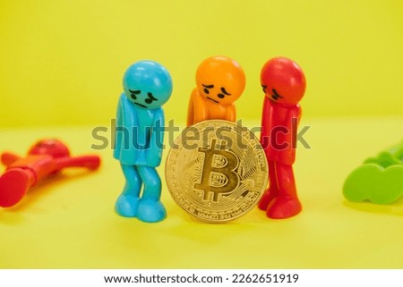 Colorful dolls looking sad after losing money on virtual currency.