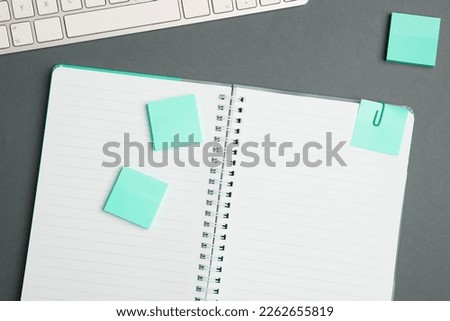 Image with school supplies, colored stickers, notebooks. Pens, pencils, rullers, calculator, keyboard. Assortment office items. Important information written on paper.