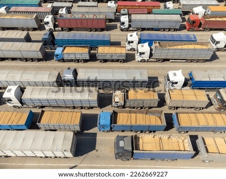 Trucks loaded with grain are waiting, top view. Trucks in the port terminal are waiting to be unloaded Royalty-Free Stock Photo #2262669227