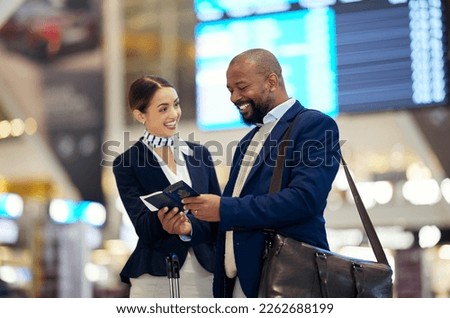 Businessman, airport and passenger assistant helping traveler in departure, flight time or passport information. Black male with female airline service agent for advice on travel, directions or FAQ Royalty-Free Stock Photo #2262688199