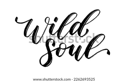 WILD SOUL. Motivation Quote. Calligraphy text wild soul. Black word on white background. Vector illustration. Inspirational design for print on tee, shirt, card, banner, poster, hoody. Royalty-Free Stock Photo #2262693525