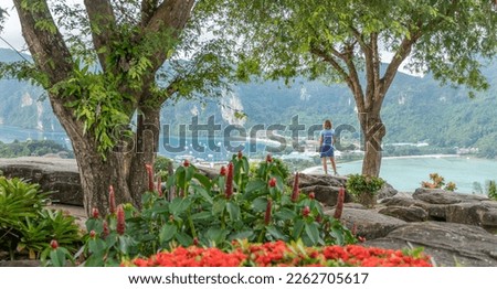 woman standing at the Phi Phi viewpoint admiring the beauty of the island Royalty-Free Stock Photo #2262705617