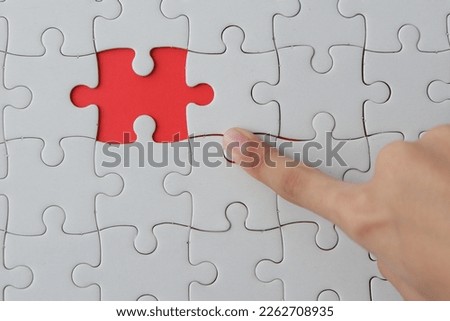 hand with jigsaw puzzle. selective focus. 