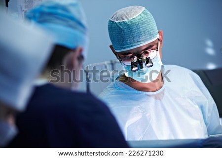 Surgeon operating live shot Royalty-Free Stock Photo #226271230