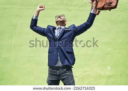 Young hispanic man executive smiling confident dancing over green background