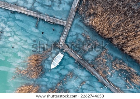 Lake Balaton aerial view with boat at winter

