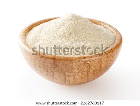 Semolina flour in wooden bowl isolated on white background with clipping path Royalty-Free Stock Photo #2262760117