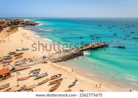 Pier and boats on turquoise water in city of Santa Maria, island of Sal, Cape Verde Royalty-Free Stock Photo #2262775675