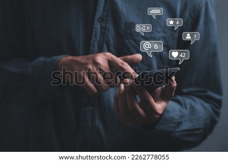 businessman using smartphone typing Live chat chatting and social network concepts, chatting conversation working on mobile phone in chat box icons pop up. Social media marketing technology concept.
