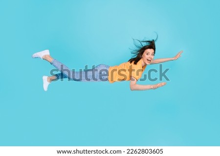 Full length photo of cartoon personage positive lady can fly sky galaxy super hero power isolated on blue color background