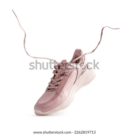 Sport shoes or sneakers for street style, running, jogging or gym with flying shoelaces isolated on white background Royalty-Free Stock Photo #2262819713