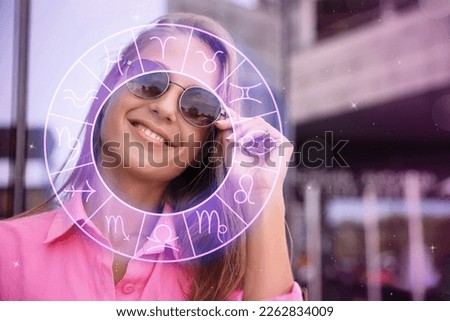 Beautiful young woman outdoors and zodiac wheel illustration Royalty-Free Stock Photo #2262834009