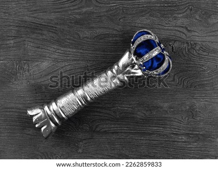 royal scepter on wooden background Royalty-Free Stock Photo #2262859833