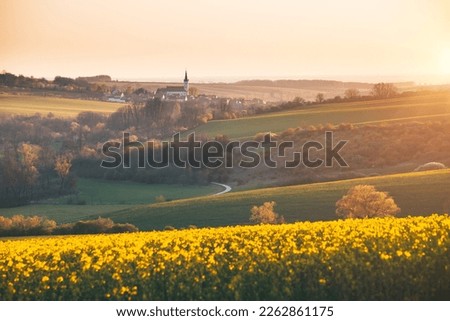 Tranquil view on of sunlit wavy fields of agricultural area. Location place of South Moravia region, Czech Republic, Europe. Photo wallpaper. Image of an ecological district. Beauty of world. Royalty-Free Stock Photo #2262861175