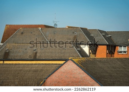 Aerial view over buildings and houses roofs in england uk.