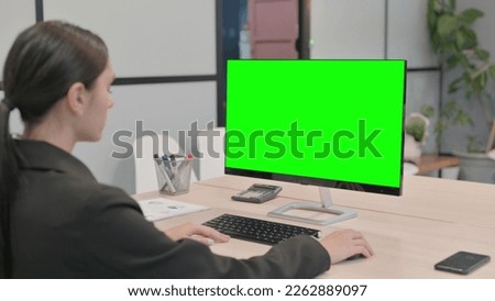 Young Businesswoman using Desktop with Green Screen