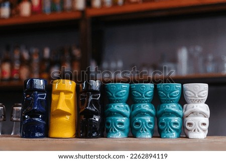Tiki bar collection on the bar close-up.