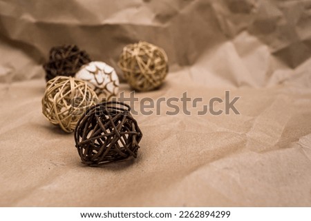 Decorative rattan round balls, on packing paper, with a place for the inscription