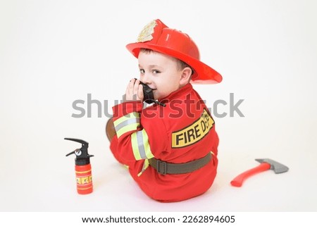Little toddler child, playing with fire truck car toy and little chicks at home, kid and pet friends playing