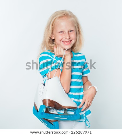 Little beautiful girl portrait with skates