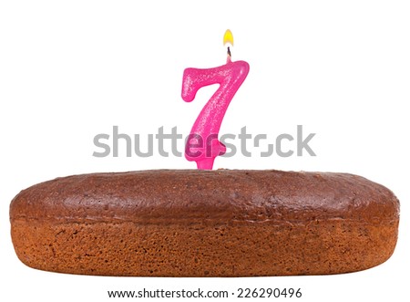 birthday cake with candles number 7 isolated on white background